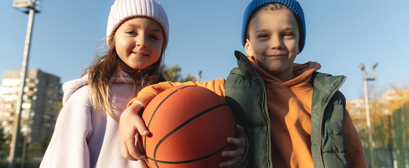 close-up-on-kids-playing-basketball.jpeg